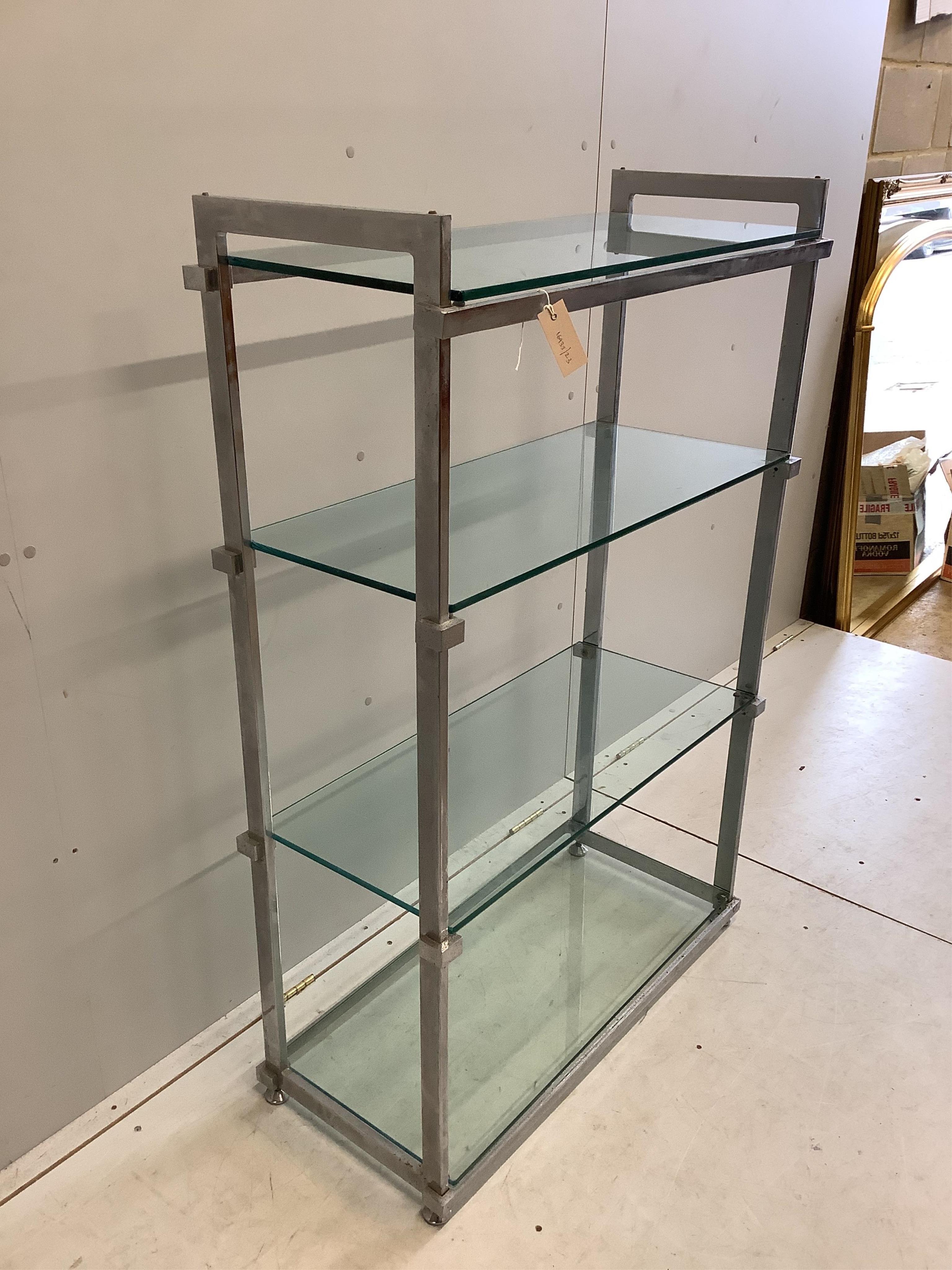 A chrome and glass four tier shelf unit, width 86cm, depth 38cm, height 130cm. Condition - fair